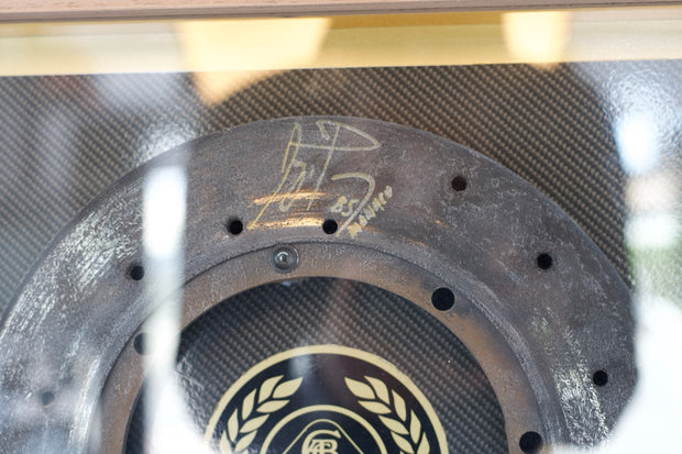 1985 Ayrton Senna Lotus brake disk signed used during the Monaco GP