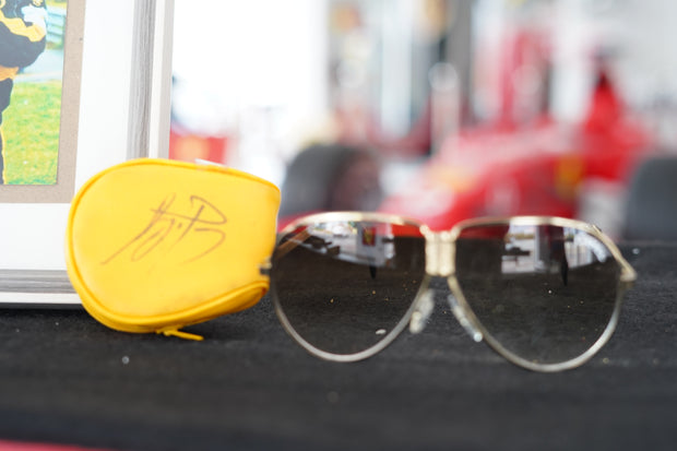 1985 Ayrton Senna personal Camel sunglasses with signed glass holder