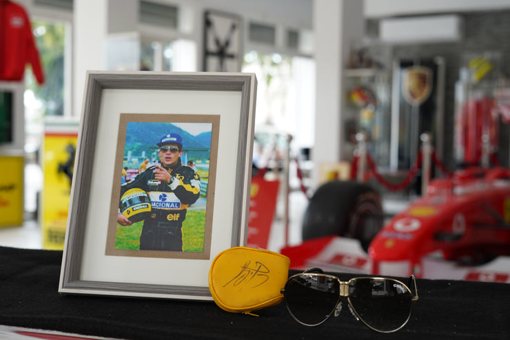 1985 Ayrton Senna personal Camel sunglasses with signed glass holder