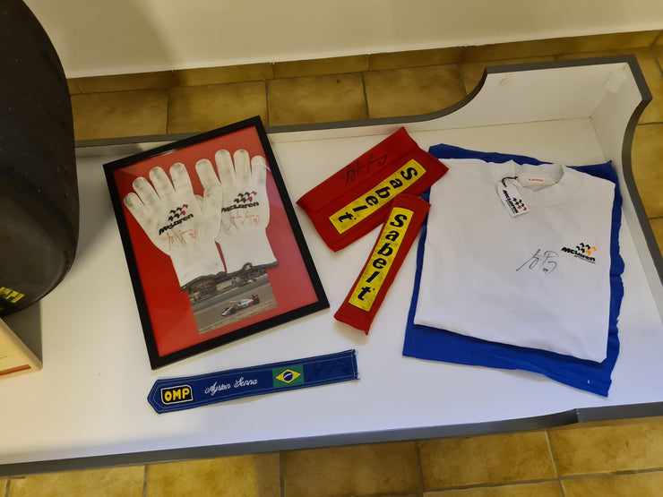 1992 McLaren pit crew gloves signed by Ayrton Senna