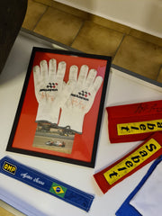 1992 McLaren pit crew gloves signed by Ayrton Senna