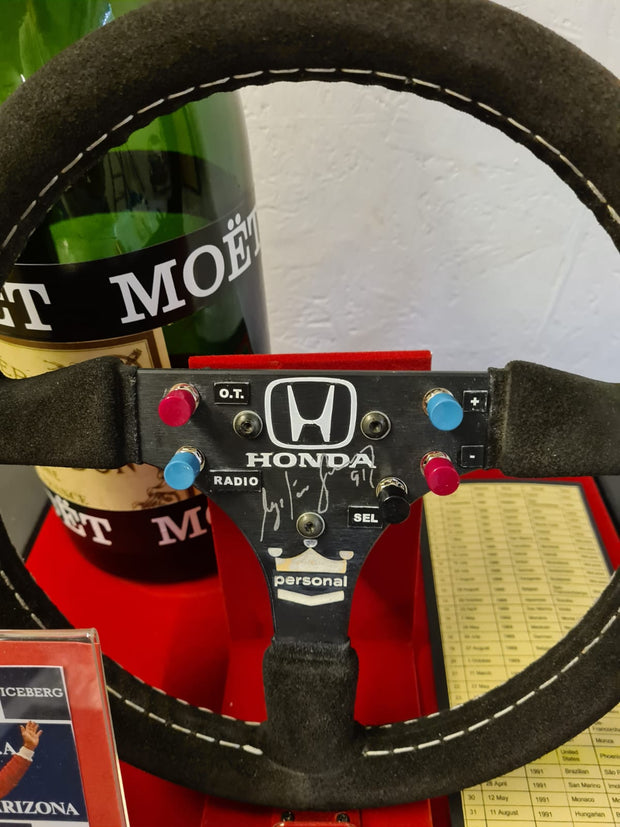 Replica Set: 1991 Ayrton Senna Steering Wheel and Podium Champagne Bottle