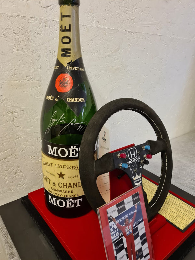 Replica Set: 1991 Ayrton Senna Steering Wheel and Podium Champagne Bottle