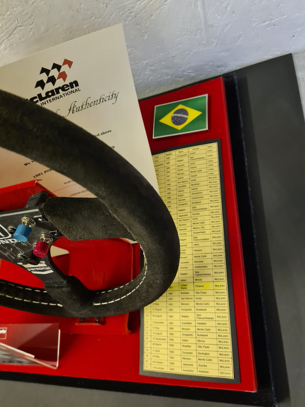 Replica Set: 1991 Ayrton Senna Steering Wheel and Podium Champagne Bottle