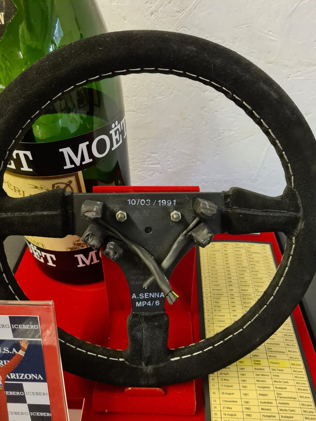Replica Set: 1991 Ayrton Senna Steering Wheel and Podium Champagne Bottle