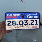2021 Official plate of the Bahrain GP signed by Charles Leclerc and Carlos Sainz Jr