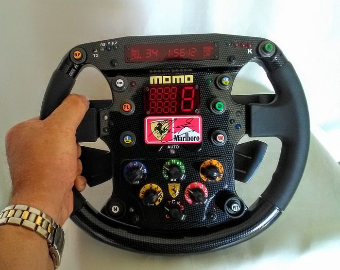 1999 Ferrari F399 replica steering signed by Michael Schumacher