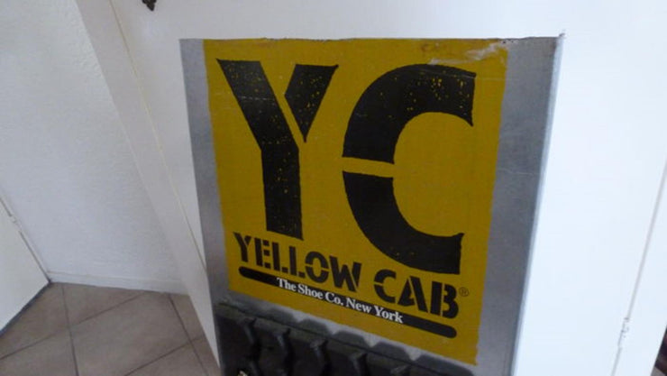 Original advertisement board of Yellow cab shoe co, New York - metal and rubber - Formula 1 Memorabilia